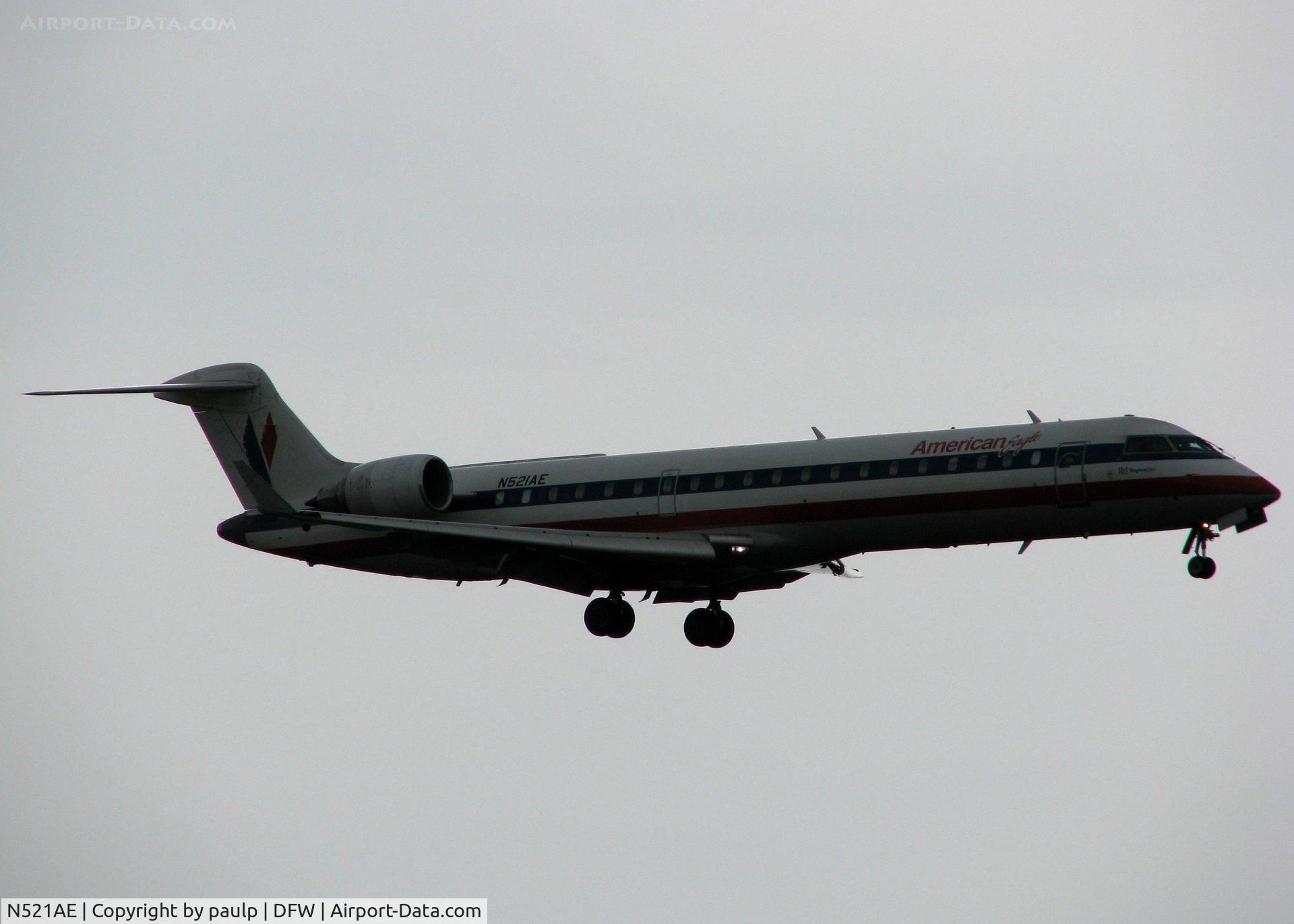 N521AE, 2004 Bombardier CRJ-701 (CL-600-2C10) Regional Jet C/N 10142, Landing on 18R at DFW on a gloomy, nasty day!