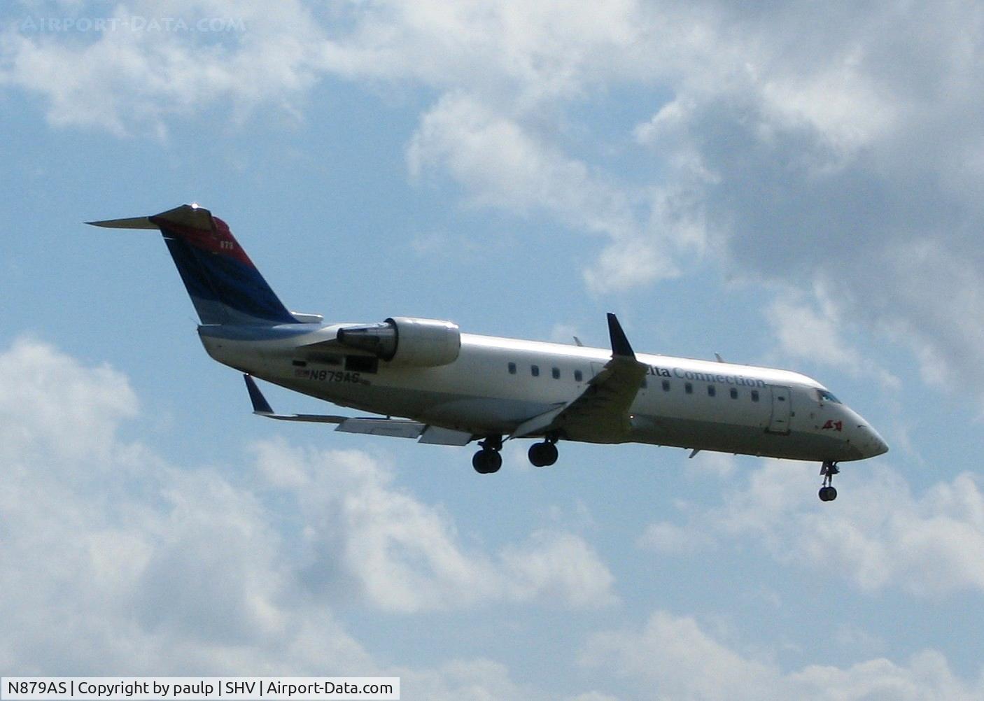 N879AS, 2002 Bombardier CRJ-200ER (CL-600-2B19) C/N 7600, Landing on 23 at Shreveport Regional.