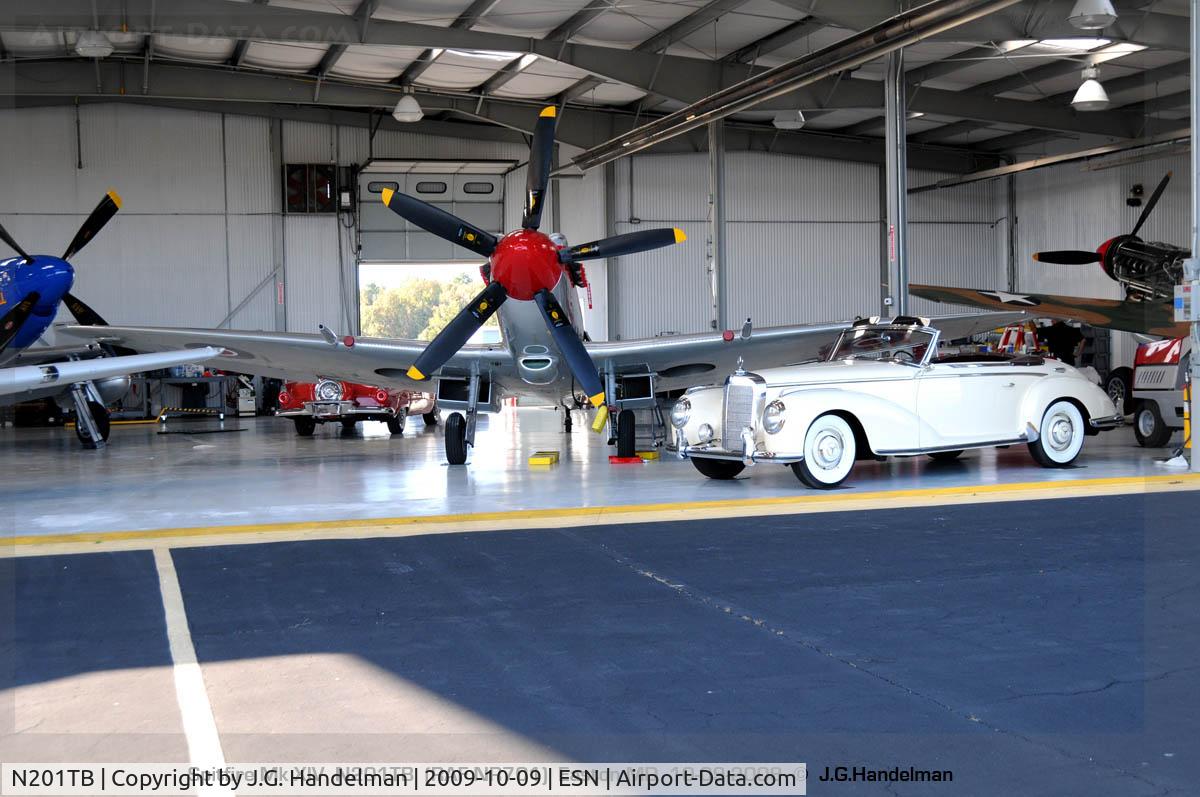 N201TB, 1945 Supermarine 361 Spitfire F.XIVe C/N 6S/663417, in hangar with other adult toys