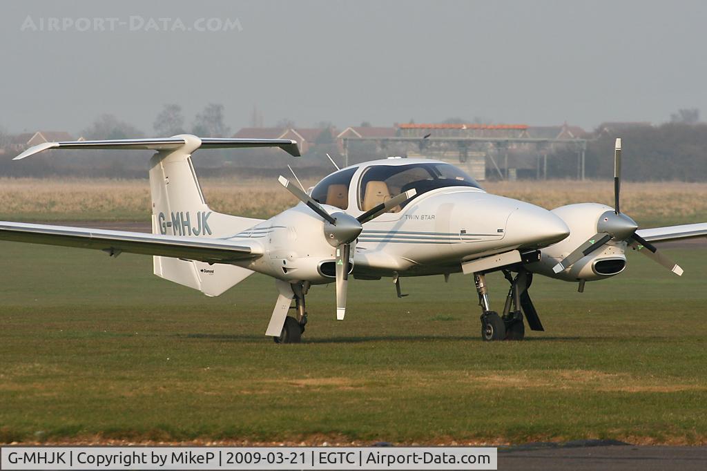 G-MHJK, 2006 Diamond DA-42 Twin Star C/N 42.173, Late afternoon at Cranfield.