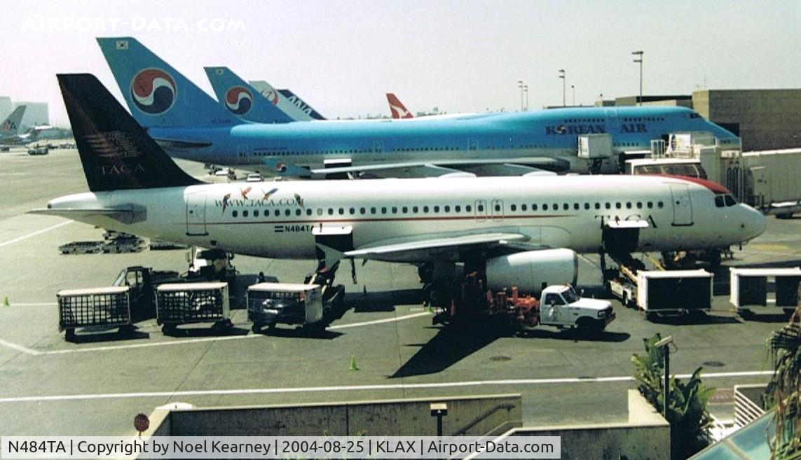N484TA, 2001 Airbus A320-233 C/N 1523, View from Tom Bradley terminal through tinted windows.