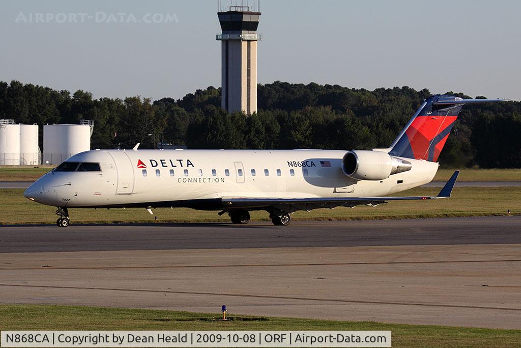 N868CA, 2000 Bombardier CRJ-100ER (CL-600-2B19) C/N 7427, Delta Connection (Comair) N868CA (FLT COM561) taxiing to RWY 23 for departure to John F Kennedy Int'l (KJFK).