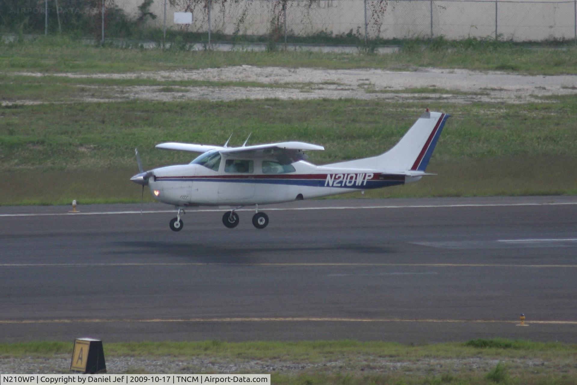 N210WP, 1977 Cessna 210M Centurion C/N 21062390, landing on runway 10
