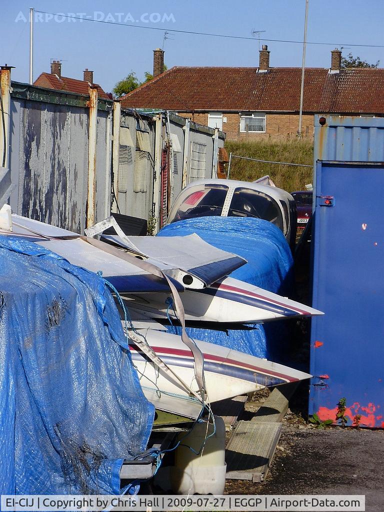 EI-CIJ, Cessna 340 C/N 340-0304, between the containers at Liverpool Airport