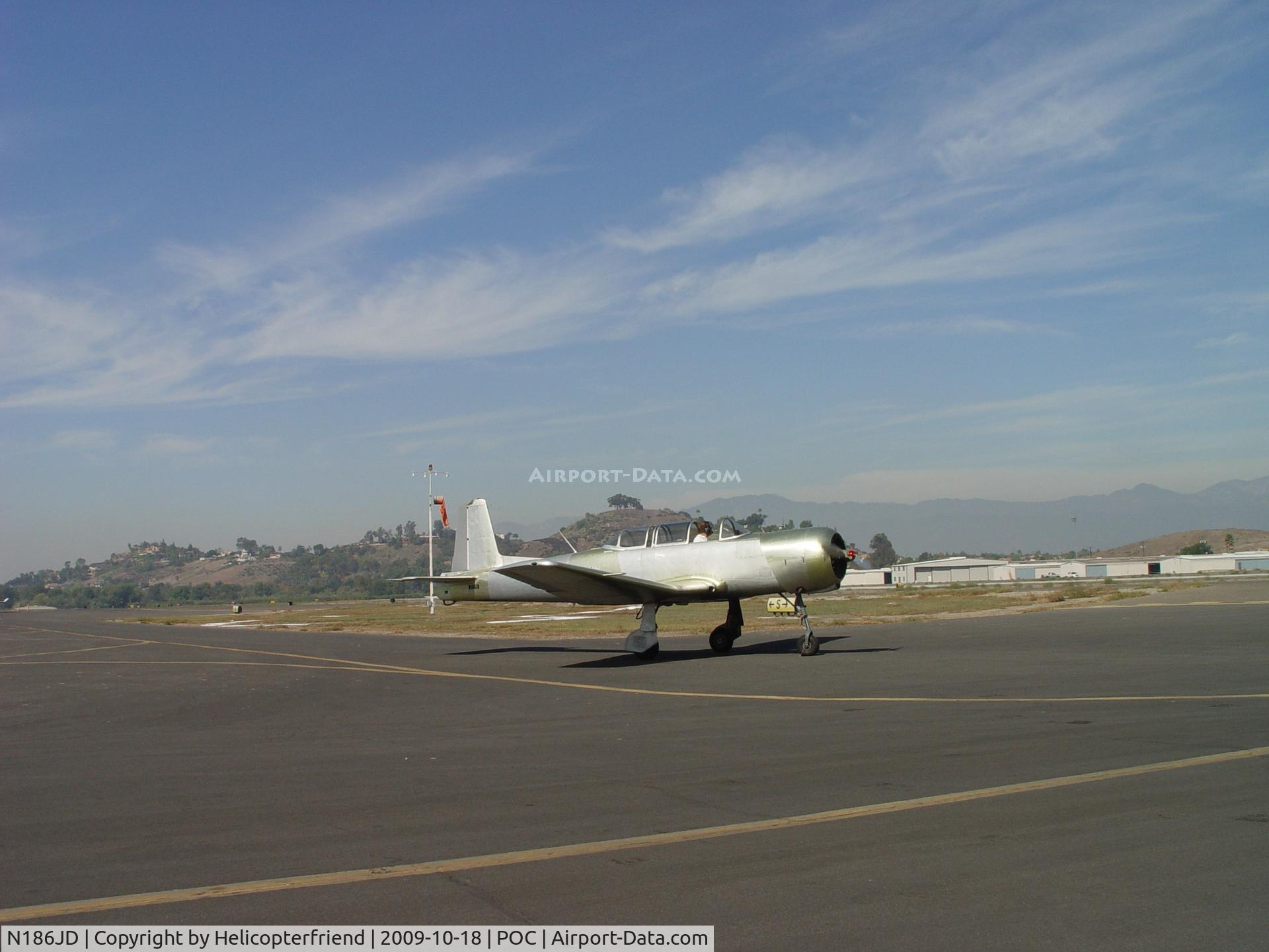 N186JD, 1973 Nanchang CJ-6A C/N 2851250, Taxiing to taxiway to head west to transient parking area
