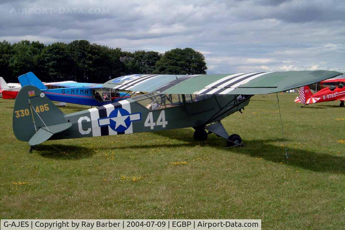 G-AJES, 1943 Piper L-4J Grasshopper (J3C-65D) C/N 11602, Piper J-3C-65 [11776]  Kemble~G 09/07/2004. PFA Fly In 2004 Kemble UK. also marked 330485 coded 44-C.