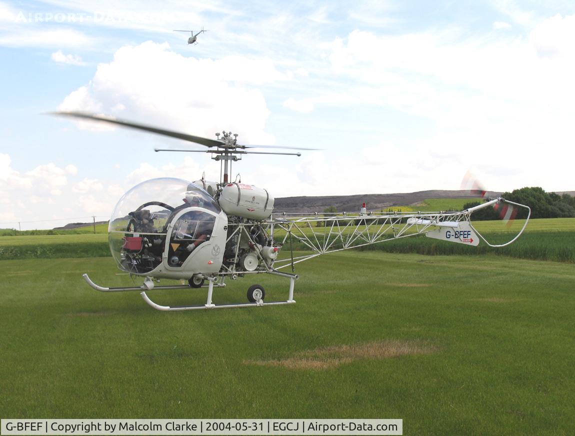 G-BFEF, 1964 Agusta AB-47G-3B-1 C/N 1541, Agusta Bell 47G-3B-1. Just touching down as G-JWEB passes overhead. At Sherburn's May Fly-in in 2004.