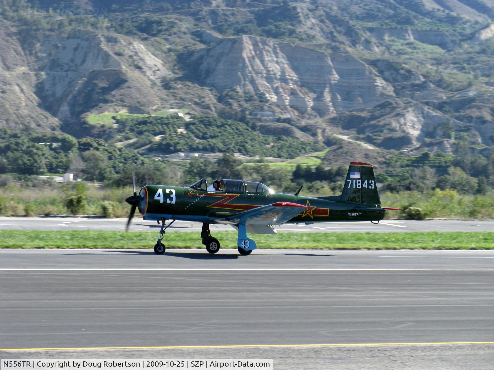 N556TR, 1968 Nanchang CJ-6A C/N 2432060, 1968 Nanchang China CJ-6A, Vedeneev  (Ivchenko) MP-14 9 cylinder 360 Hp radial upgrade conversion, Winner-Best Nanchang CJ-6A Award at EAA AirVenture 2009, landing roll Rwy 04