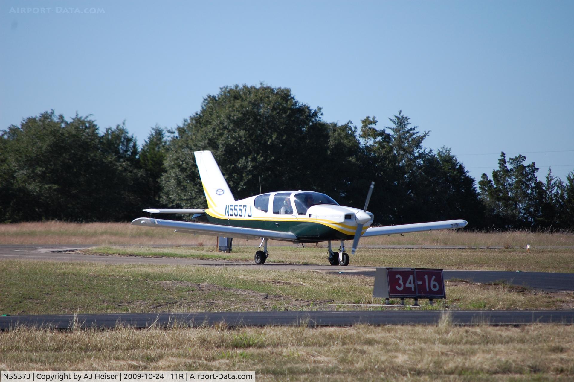 N5557J, Socata TB-9 C/N 1326, N5557J taxiing off of rwy 16 to parking at 11R