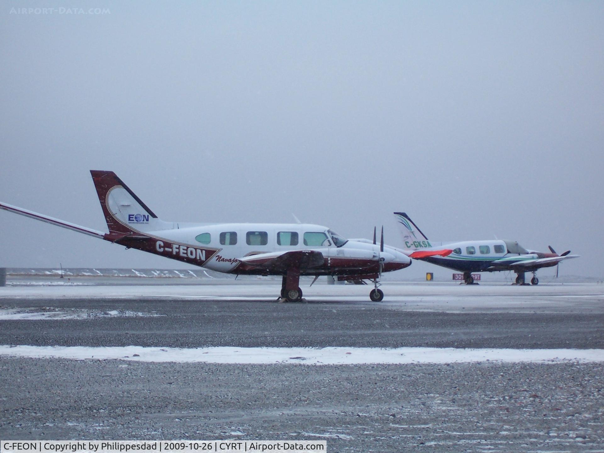 C-FEON, 1974 Piper PA-31 C/N 31-7401249, C-FEON at Rankin Inlet, NU 2009oct26 with C-GKSA in background