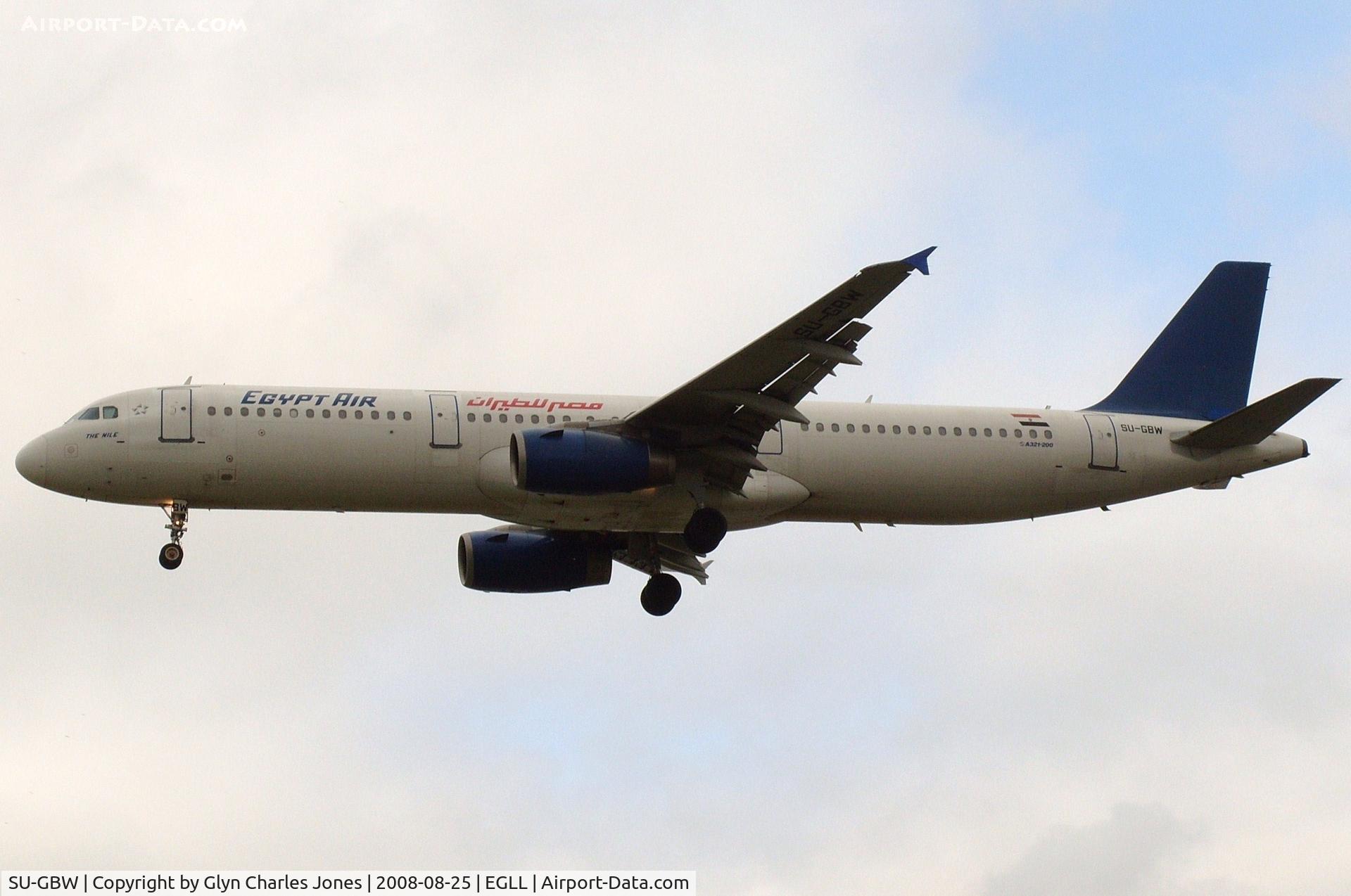 SU-GBW, 1997 Airbus A321-231 C/N 725, 'The Nile' with plain blue tail on finals for runway 27L. Test registration was D-AVZA. Operated by Egyptair.