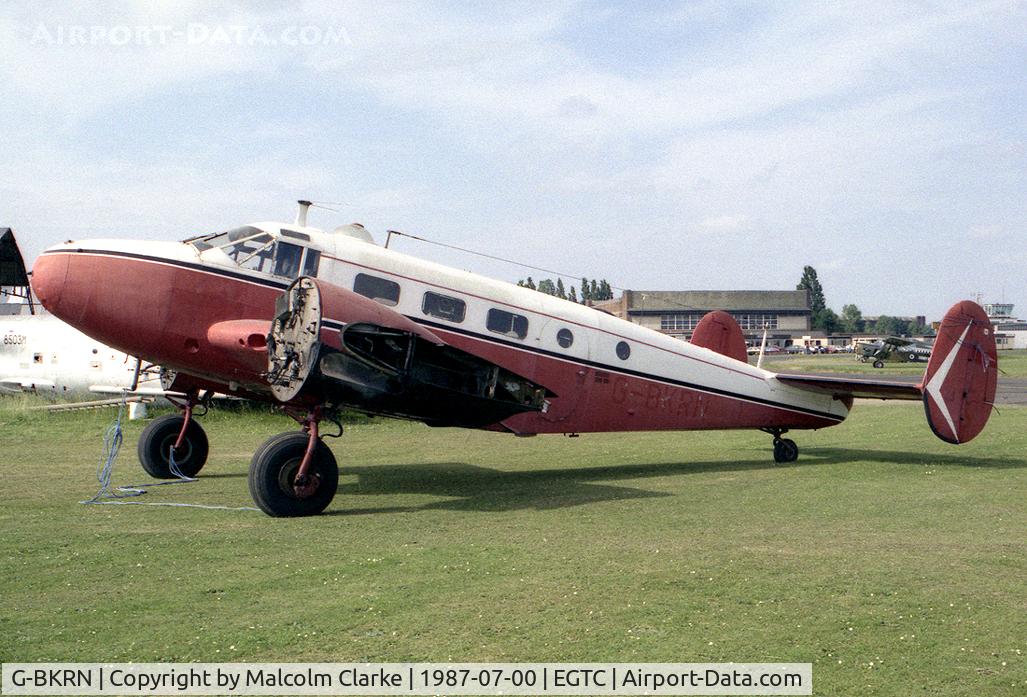 G-BKRN, 1952 Beech D18S C/N CA-75, Beech D18S. At the time this photograph was taken, in 1987, it was in the hands of the Vintage Aircraft Team at Cranfield who preserved it in the condition shown until it was purchased in 1996 for restoration to flying condition by Beech Restorations.