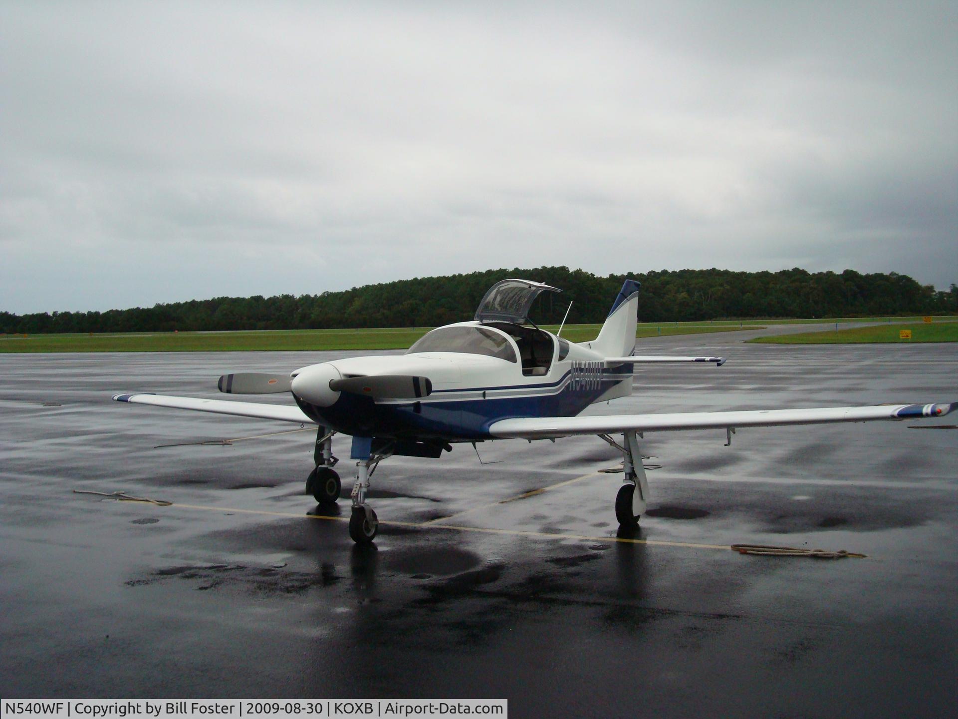 N540WF, 2008 Glasair III C/N 001, Waiting for rain shower to pass.