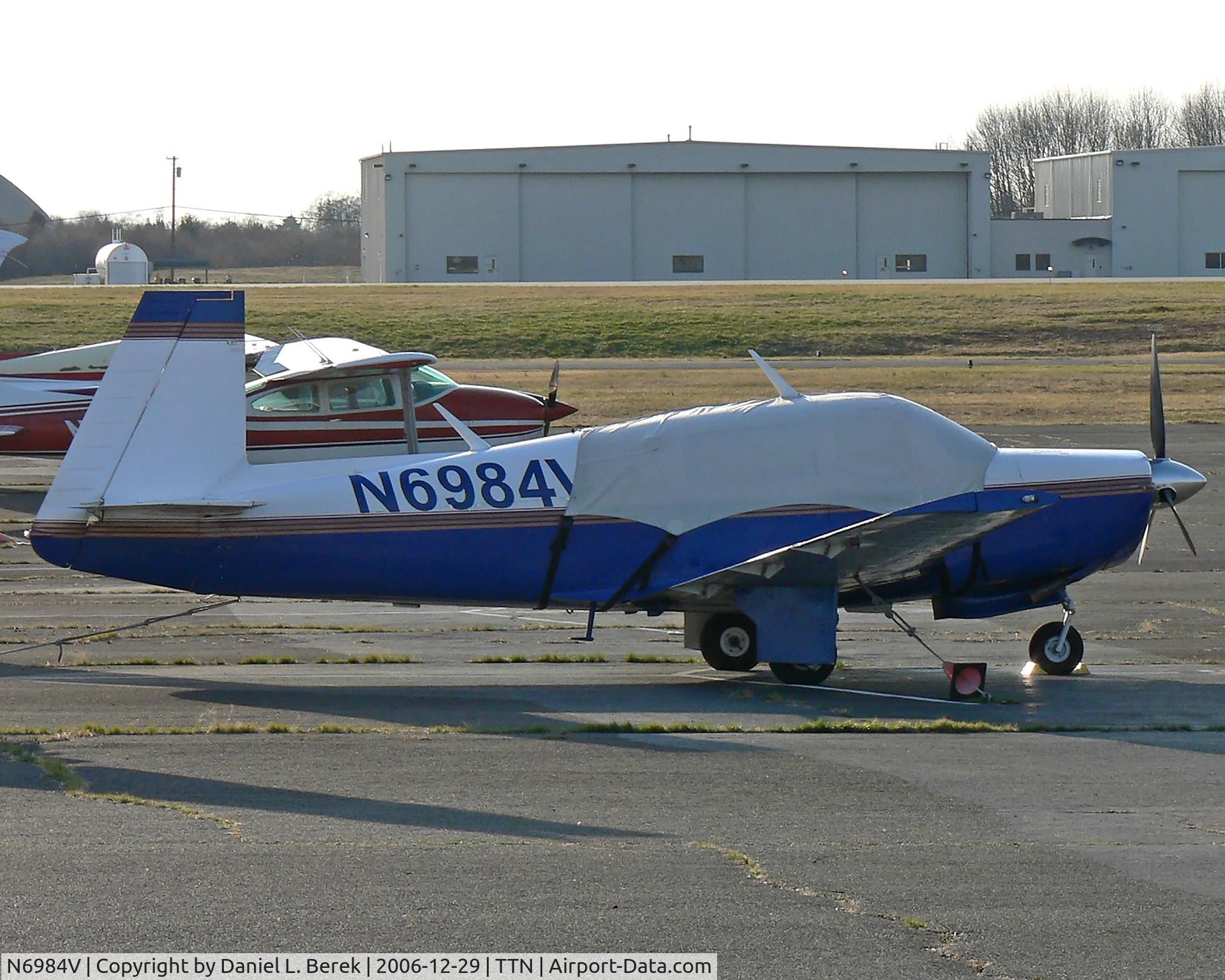 N6984V, 1976 Mooney M20F Executive C/N 22-1346, These old Mooney aircraft hold their age very well.  This beauty dates back to 1976.  If only I could "undress" her and remove that tarp.  She is seen at Trenton - Mercer County Airport (TTN).