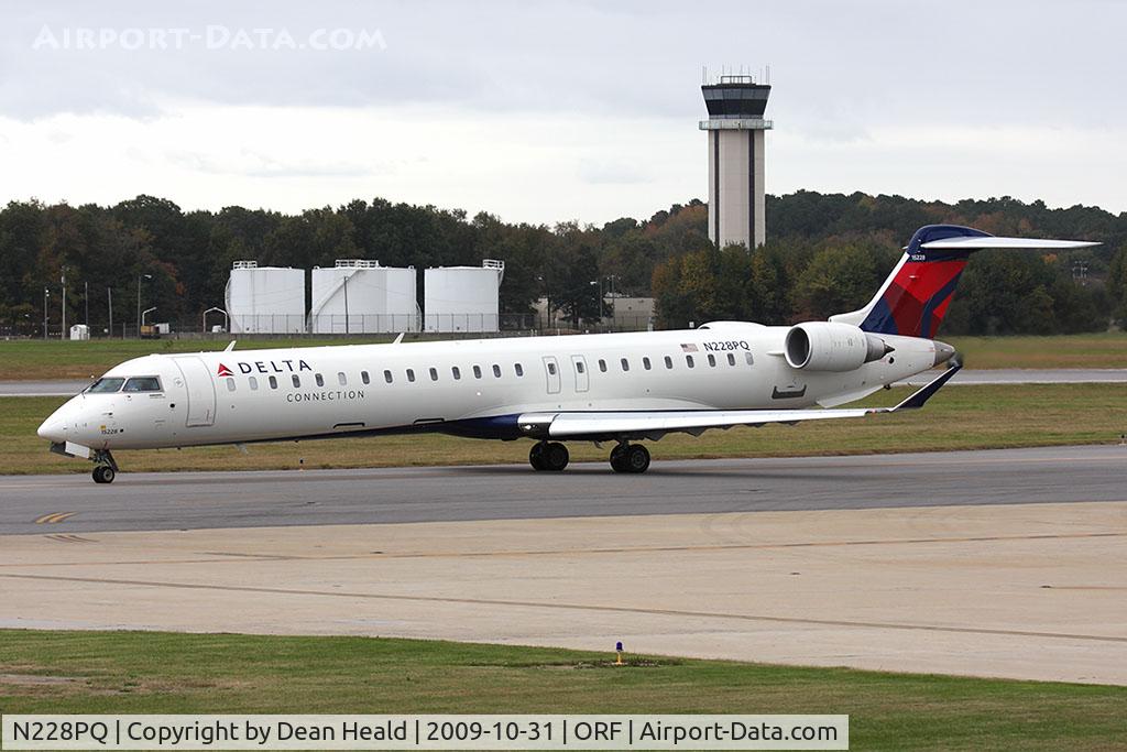 N228PQ, 2009 Bombardier CRJ-900ER (CL-600-2D24) C/N 15228, Delta Connection (Pinnacle Airlines) N228PQ (FLT FLG873) taxiing to RWY 23 for departure to Hartsfield-Jackson Atlanta Int'l (KATL). This aircraft was delivered 04-09-2009.