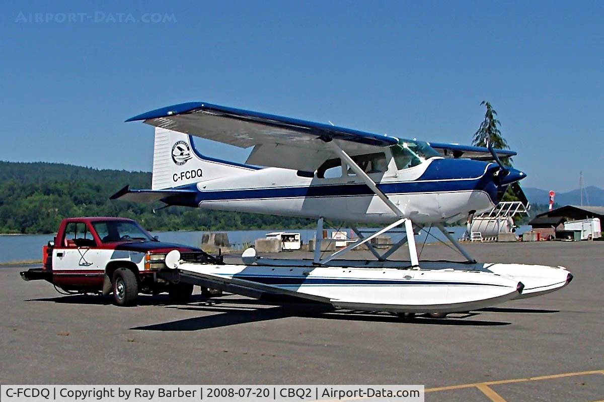 C-FCDQ, 1970 Cessna 180H Skywagon C/N 18052166, Seen being towed out for fueling at Fort Langley before departure on the Fraser River. Note the adapted vehicle used for the floatplanes at the base.