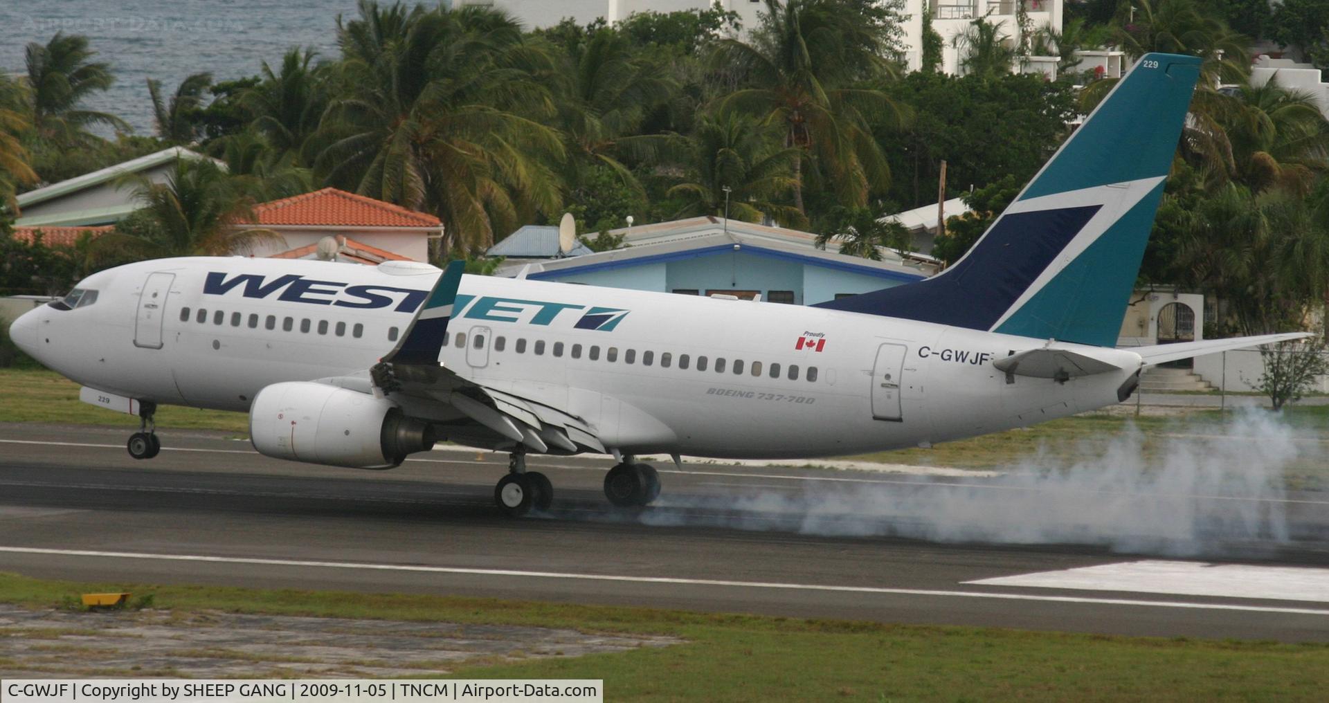C-GWJF, 2004 Boeing 737-7CT C/N 32766, touch down at tncm