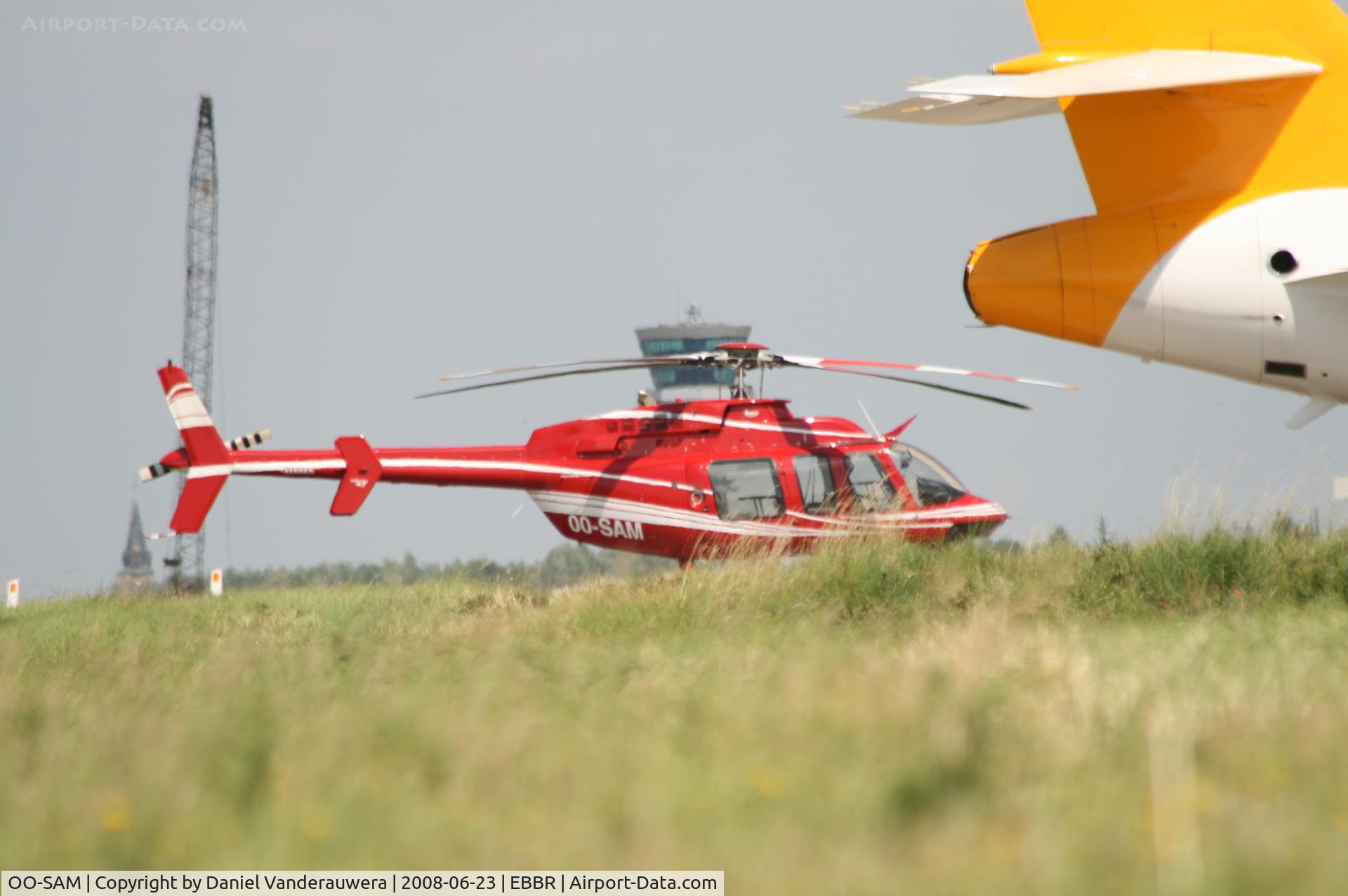 OO-SAM, 2007 Bell 407 C/N 53752, parked on General Aviation apron