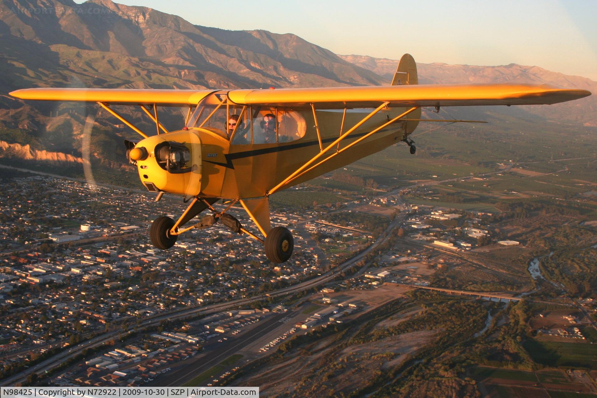 N98425, 1946 Piper J3C-65 Cub Cub C/N 18612, Air to Air over Santa Paula. Shot from N72922