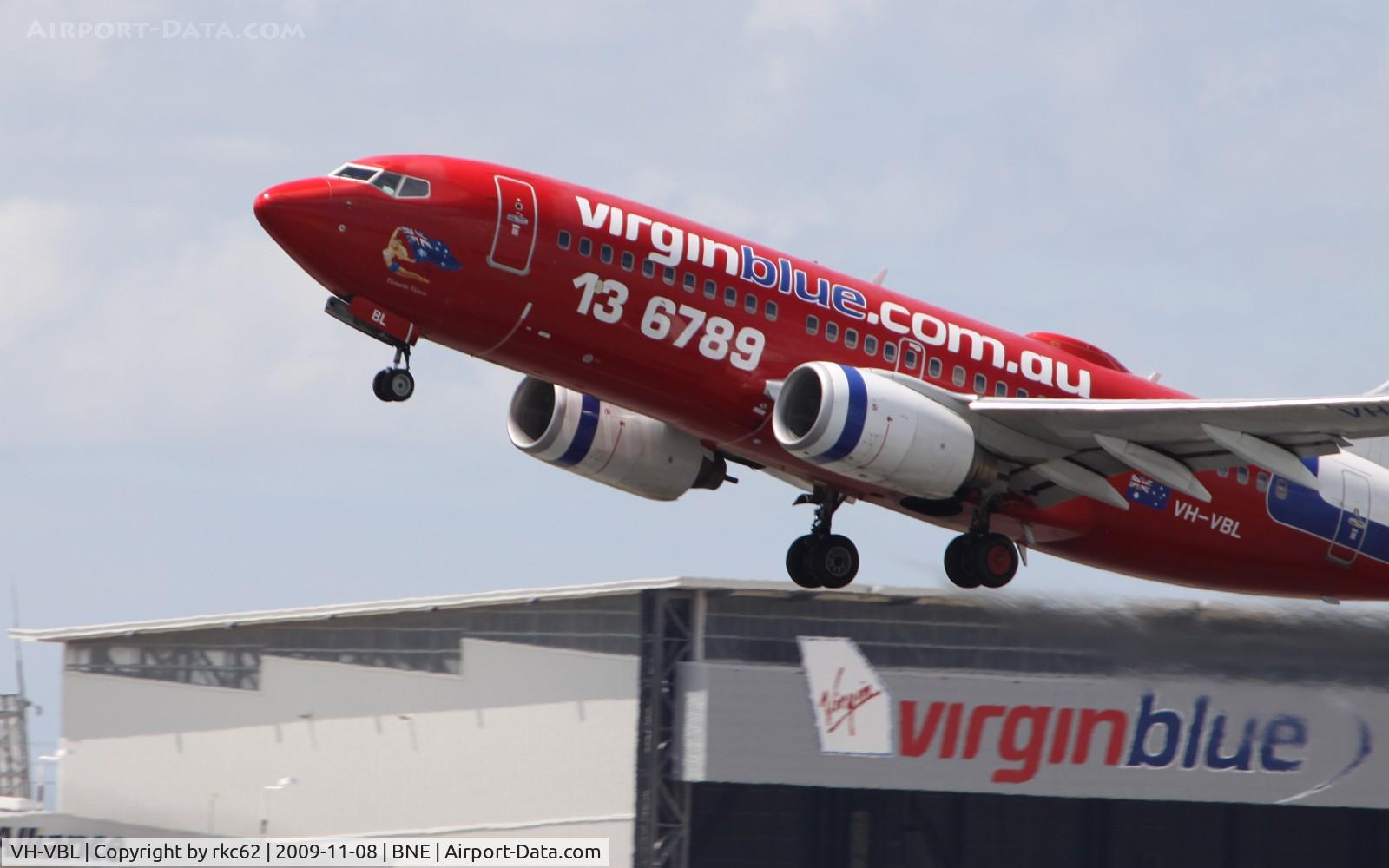 VH-VBL, 2002 Boeing 737-7Q8 C/N 30633, VirginBlue 737 over VirginBlue Maintenance Facility