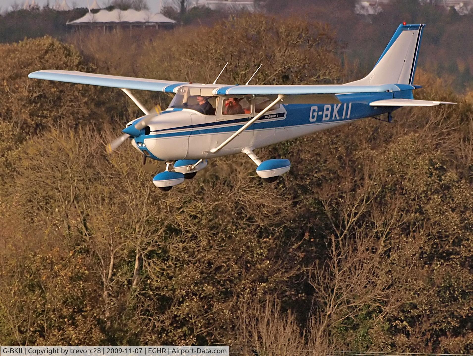 G-BKII, 1975 Reims F172M ll Skyhawk C/N 1370, landing at Goodwood with autumnal background