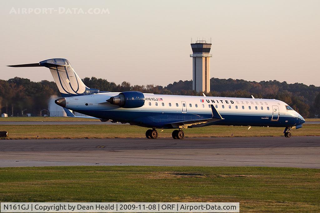 N161GJ, 2006 Bombardier CRJ-550 (CL-600-2C11) C/N 10253, United Express (GoJet Airlines) N161GJ (FLT GJS7373) taxiing to the gate after arrival on RWY 5 from Washington Dulles Int'l (KIAD) late in the day.