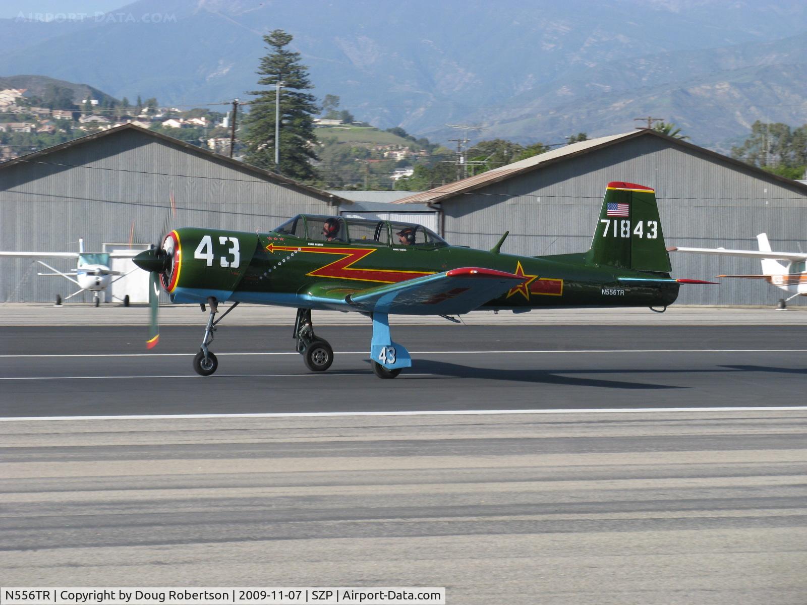 N556TR, 1968 Nanchang CJ-6A C/N 2432060, 1968 Nanchang China CJ-6A, Vedeneev (Ivchenko) MP-14 9 cylinder 360 Hp radial upgrade conversion, Winner-Best Nanchang China CJ-6A Award at EAA AirVenture 2009, takeoff roll Rwy 22 departing to TOA, Winner-Warbird Preservation Award EAA AirVenture 2010.