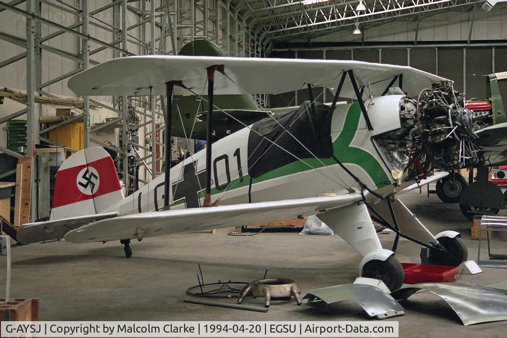 G-AYSJ, 1938 Bucker Bu-133C Jungmeister C/N 38, Doflug Bu-133C Jungmeister.  Undergoing engine maintenance at The Imperial War Museum, Duxford, UK.