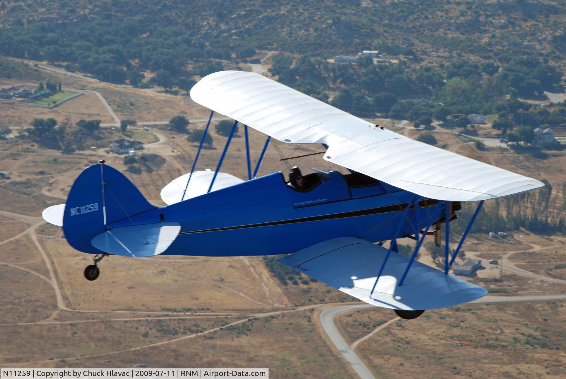 N11259, 1931 Waco RNF C/N 3462, WAco RNF over Ramona, CA countryside