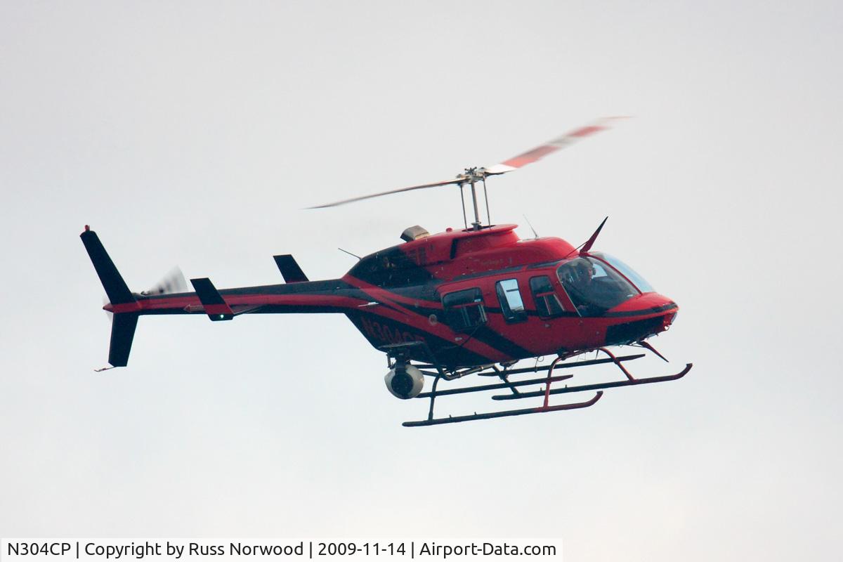 N304CP, 1998 Bell 206L-4 LongRanger IV LongRanger C/N 52204, Making low passes for film/video over University Lakes in Baton Rouge, LA