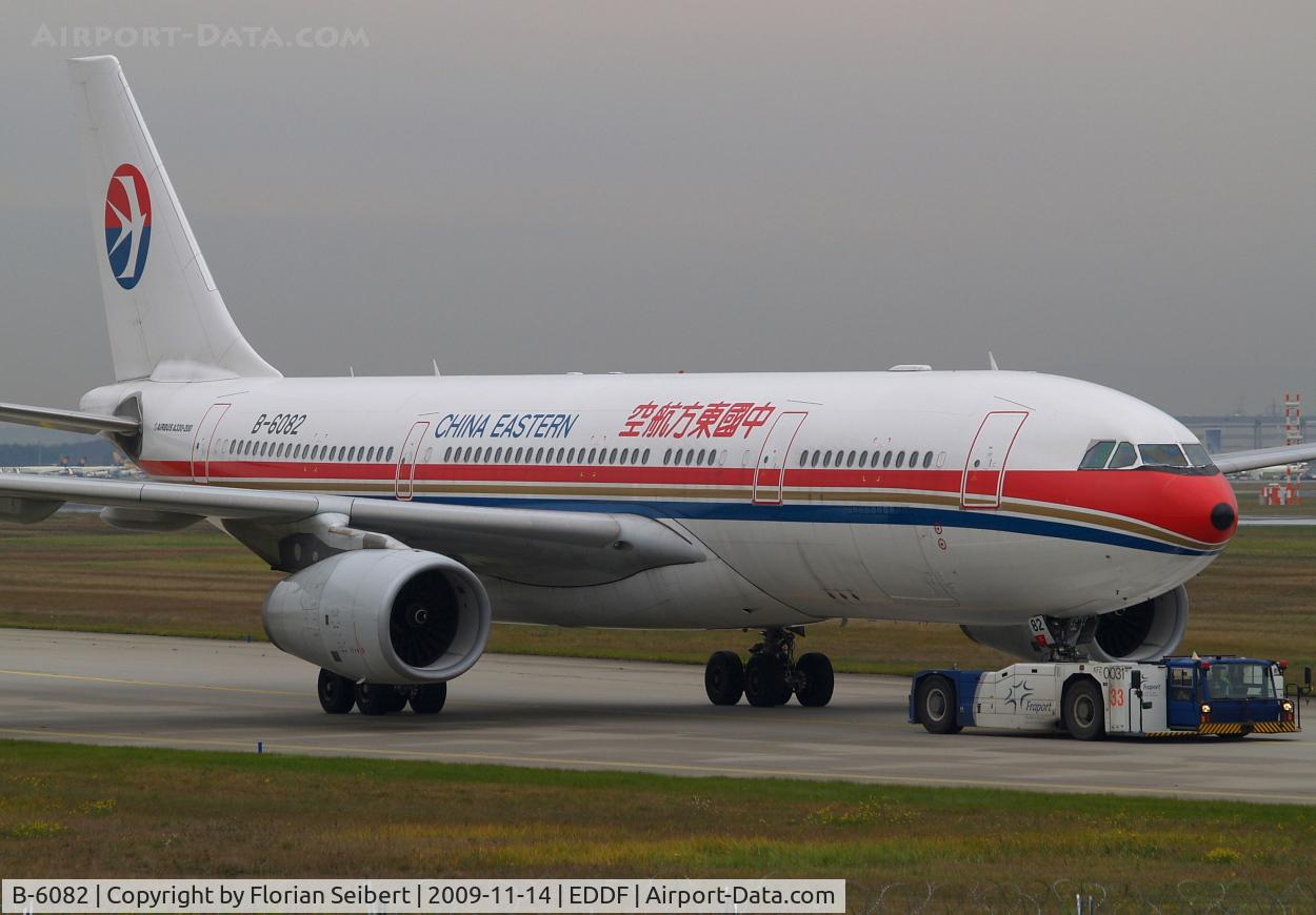 B-6082, 2007 Airbus A330-243 C/N 821, getting towed to her gate