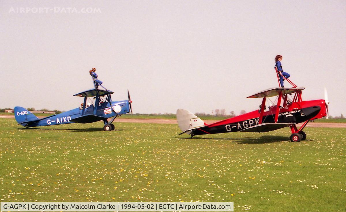 G-AGPK, 1945 De Havilland DH-82A Tiger Moth II C/N 86566, De Havilland DH-82A Tiger Moth II Built in 1945 and seen here with fellow wing-walking Moth G-AIXD at Cranfield Airport, UK.
