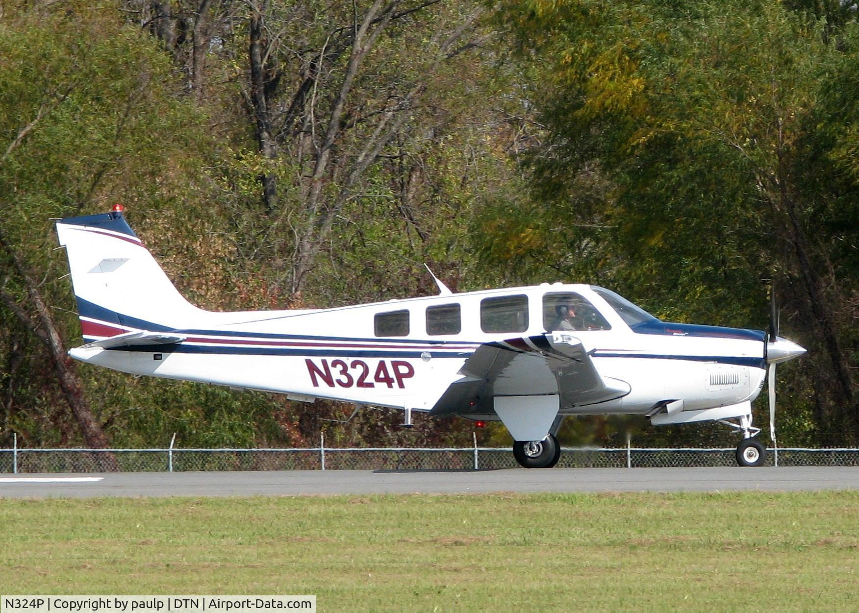 N324P, 2006 Beech G36 Bonanza C/N E-3730, Rolling for take off at Downtown Shreveport.