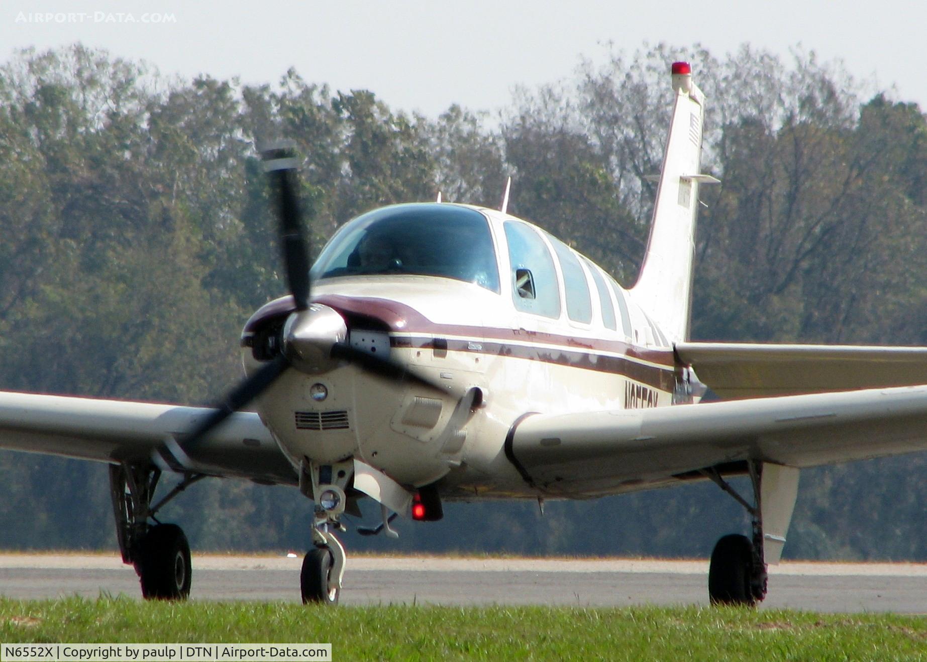 N6552X, 1983 Beech B36TC Bonanza C/N EA-325, Taxiing to the active at Downtown Shreveport.