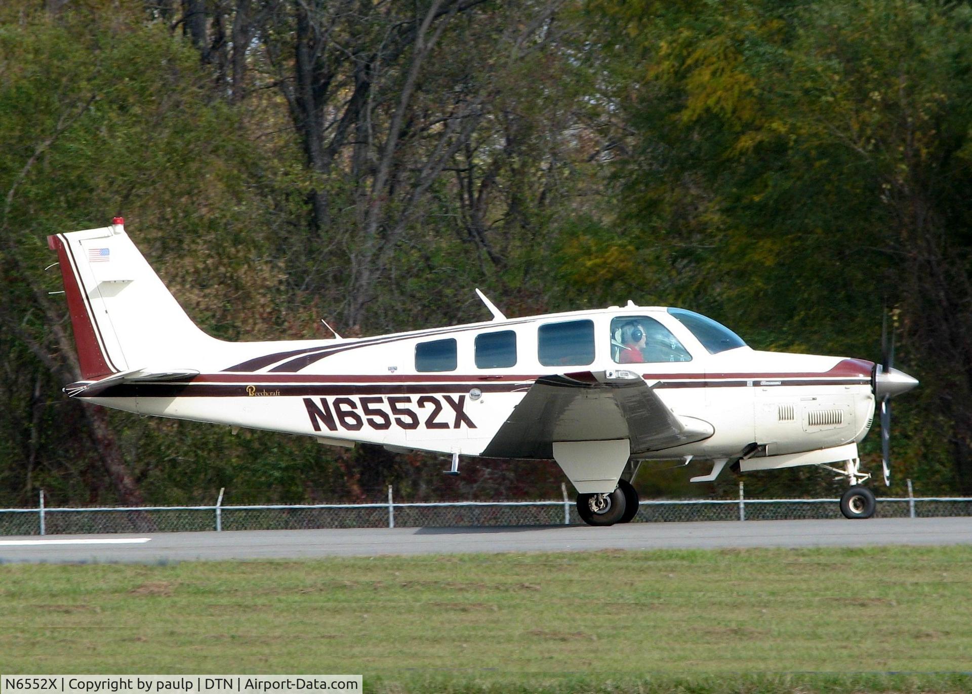 N6552X, 1983 Beech B36TC Bonanza C/N EA-325, Rolling for take off at Downtown Shreveport.