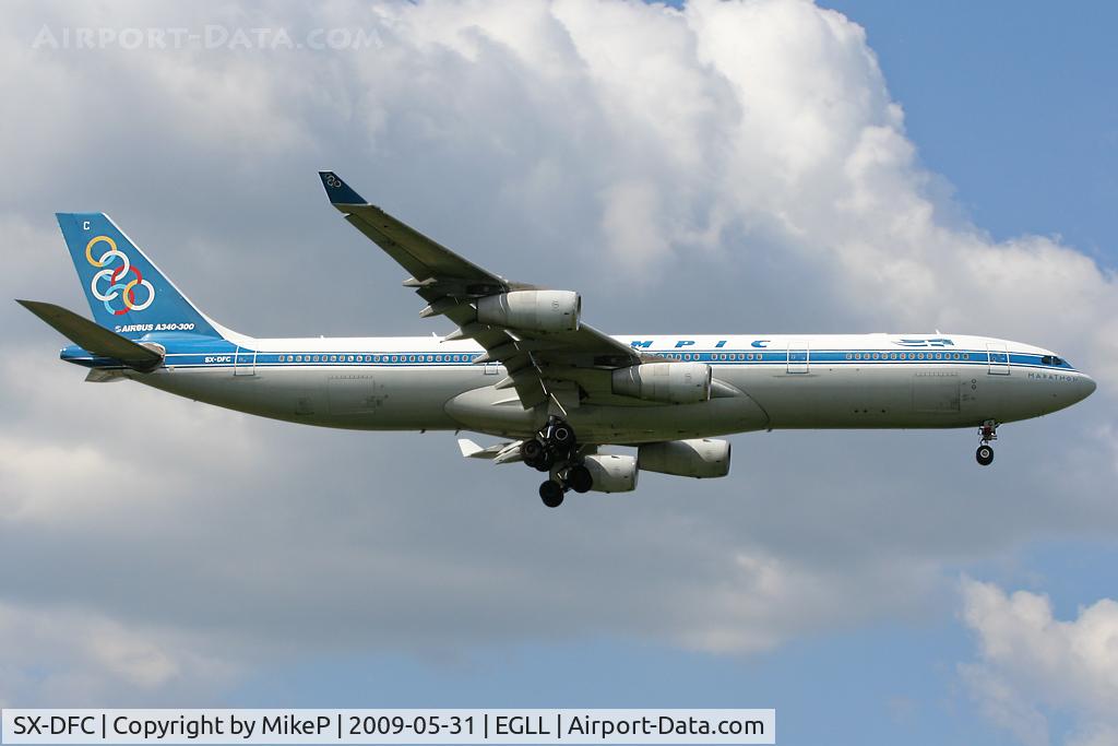 SX-DFC, 1999 Airbus A340-313 C/N 280, Short final for Runway 09L at Heathrow.