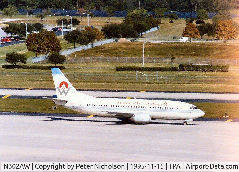 N302AW, 1988 Boeing 737-3G7 C/N 24009, American West Airlines Boeing 737 arriving at Tampa in November 1995.