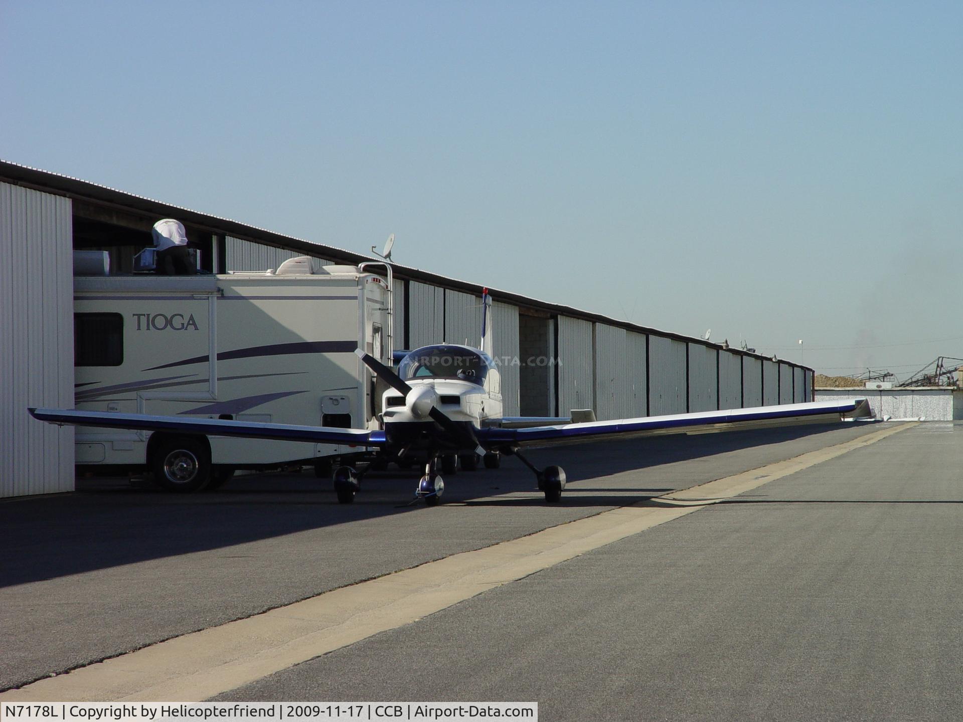N7178L, 1974 Grumman American AA-5 Traveler C/N AA5-0678, Parked outside while motorhome receives some attention