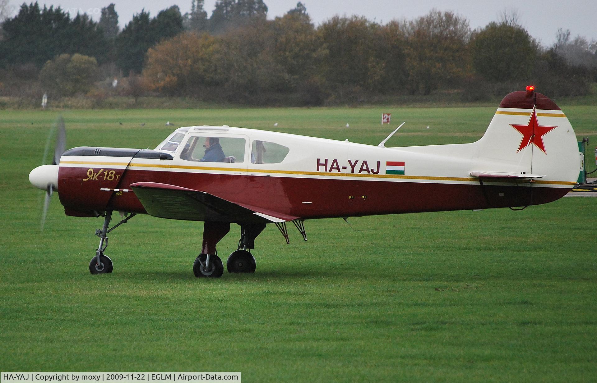 HA-YAJ, 1993 Yakovlev Yak-18T C/N 12055, YAK-18T taxi in the rain at White Waltham