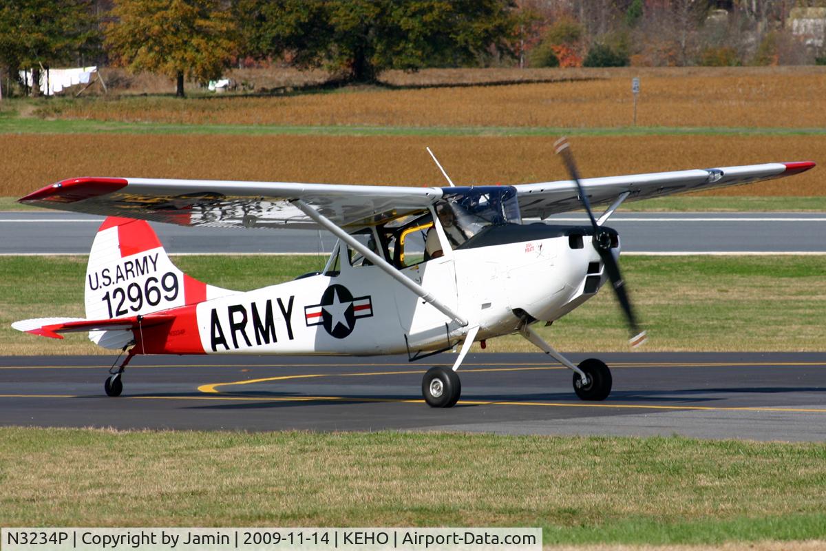 N3234P, 1961 Cessna O-1E Bird Dog C/N 305M-0015, Taxiing up the hill to the ramp during a fly-in.