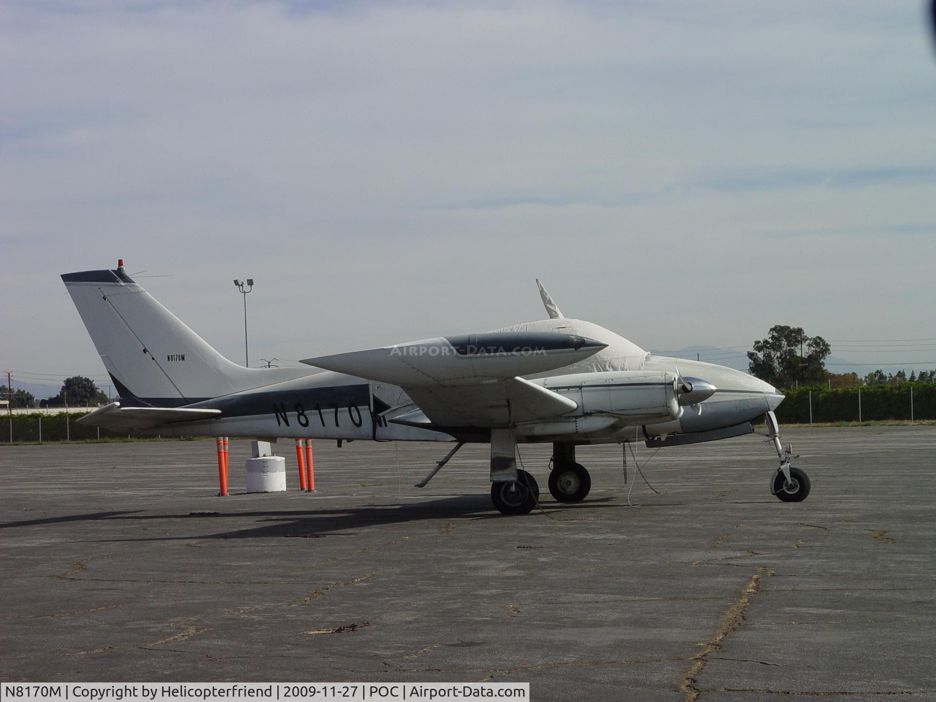 N8170M, 1964 Cessna 310I C/N 310I0170, Tied down, covered and waiting at Howard Aviation