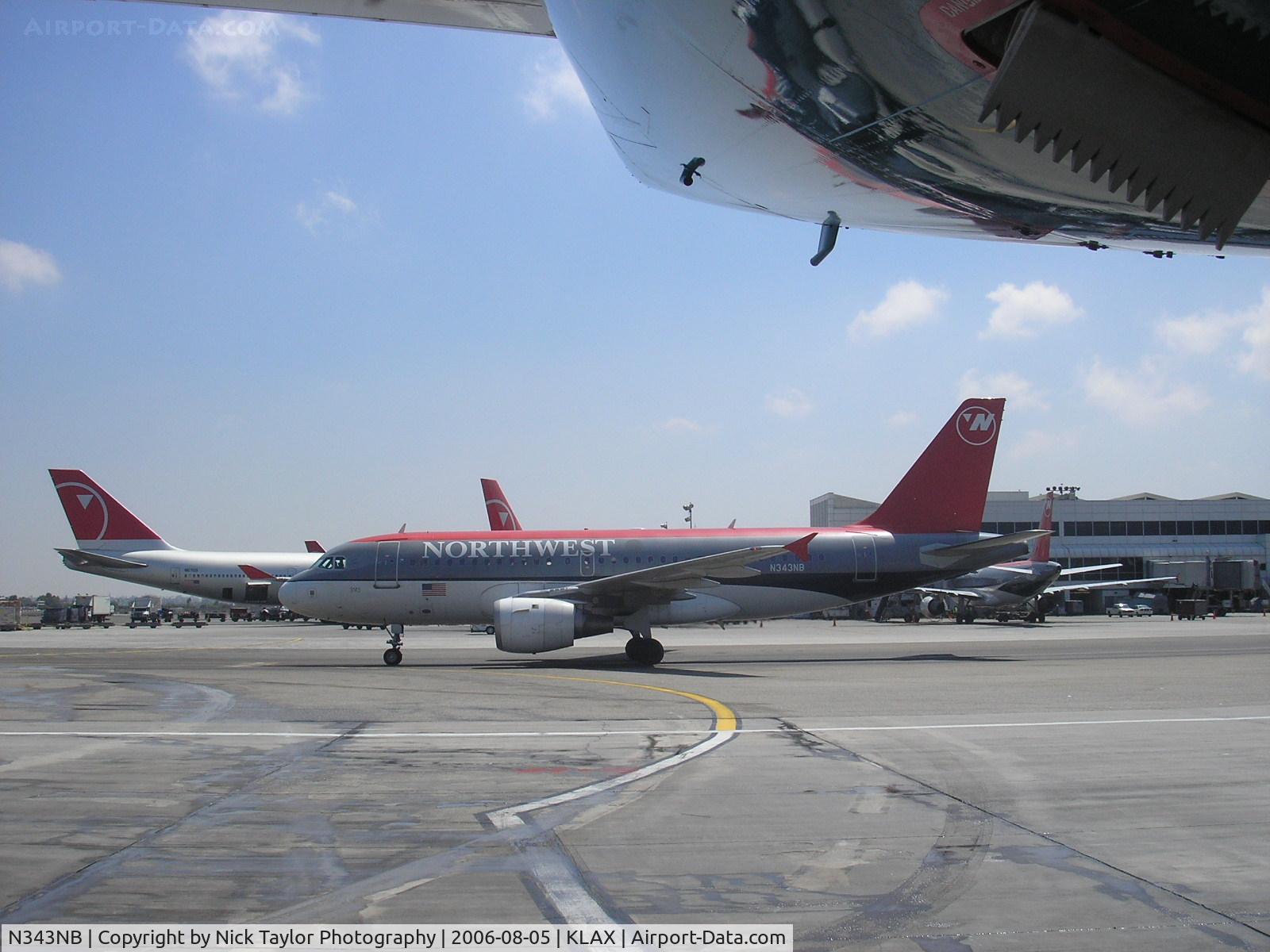N343NB, 2002 Airbus A319-114 C/N 1752, Taxiing out of the alley