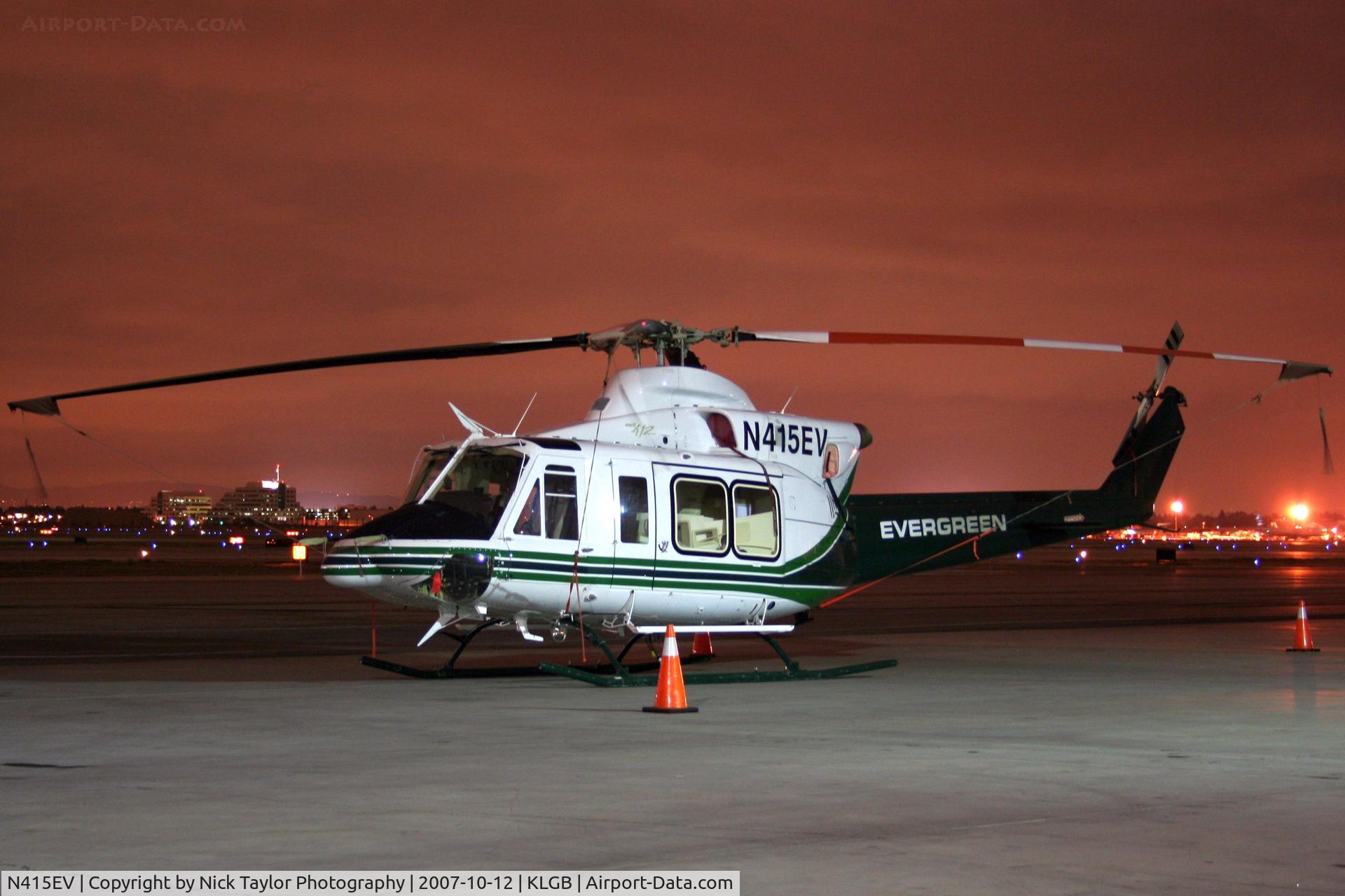 N415EV, 2006 Bell 412EP C/N 36404, Overnight at the Mercury FBO ramp. To be put on a ship the next day.