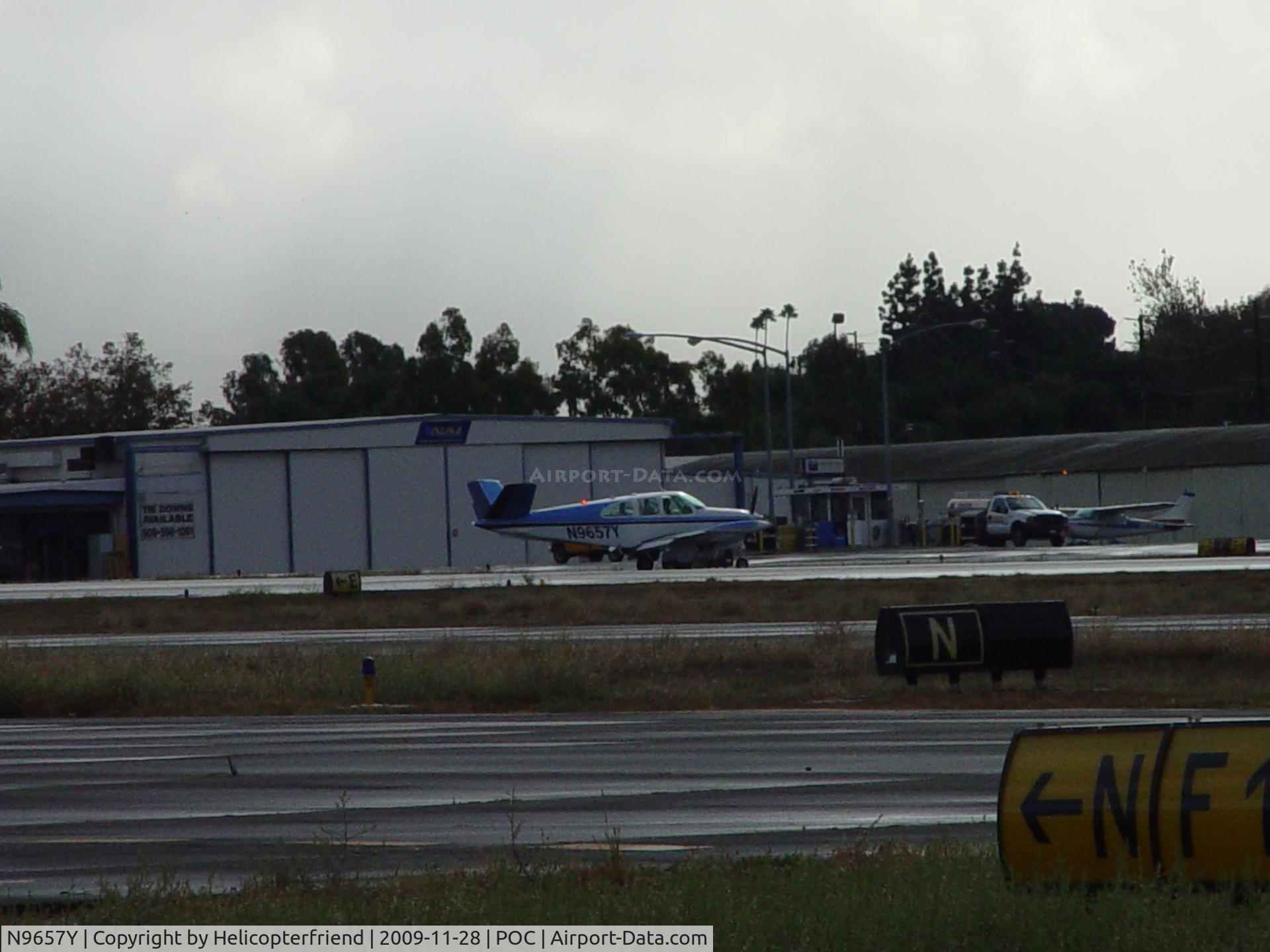 N9657Y, 1962 Beech P35 Bonanza C/N D-7072, Taxiing to Transient Parking
