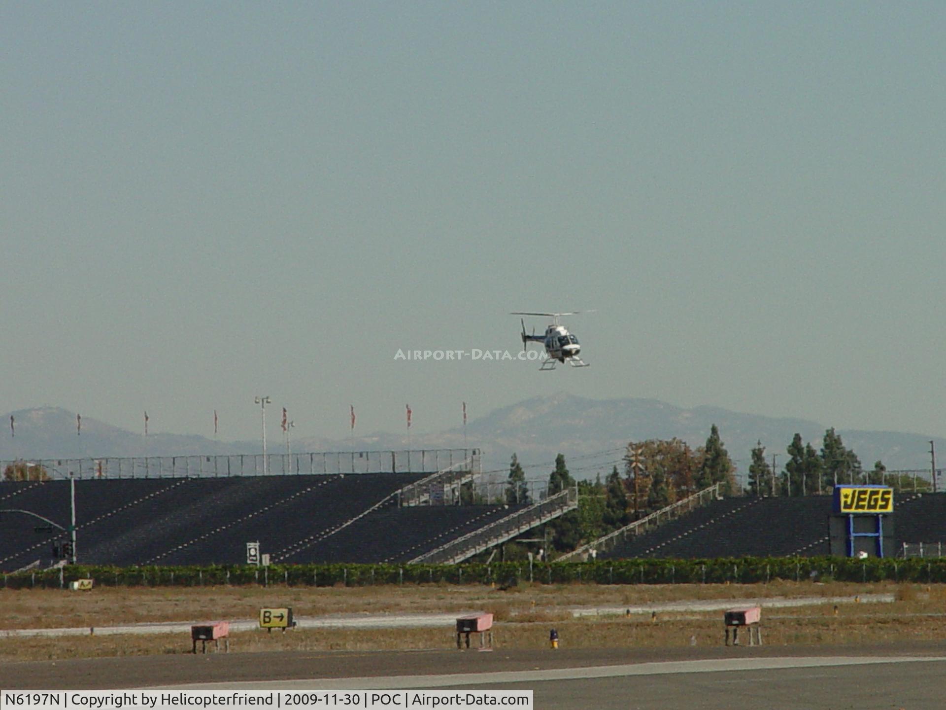 N6197N, 1993 Bell 206L-4 LongRanger IV LongRanger C/N 52014, Turning into the wind on final to 26R