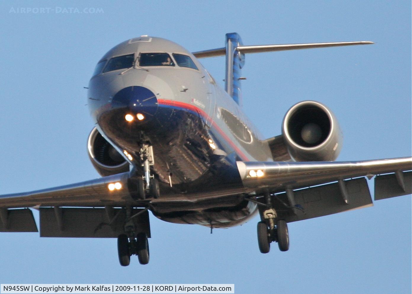 N945SW, 2003 Bombardier CRJ-200LR (CL-600-2B19) C/N 7770, SkyWest Airlines CL-600-2B19, SKW6270 short final 27L, from KFSD.