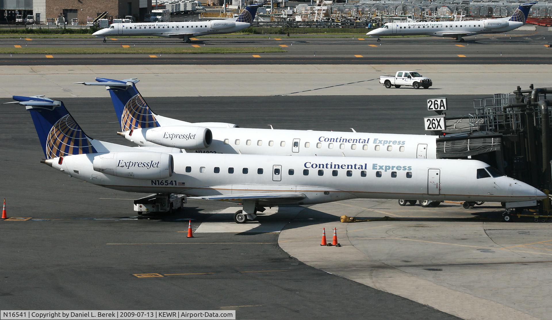 N16541, 2001 Embraer ERJ-145LR (EMB-145LR) C/N 145542, Accompanied by a sibling, an Express Jet awaits her next load of passengers at Newark.
