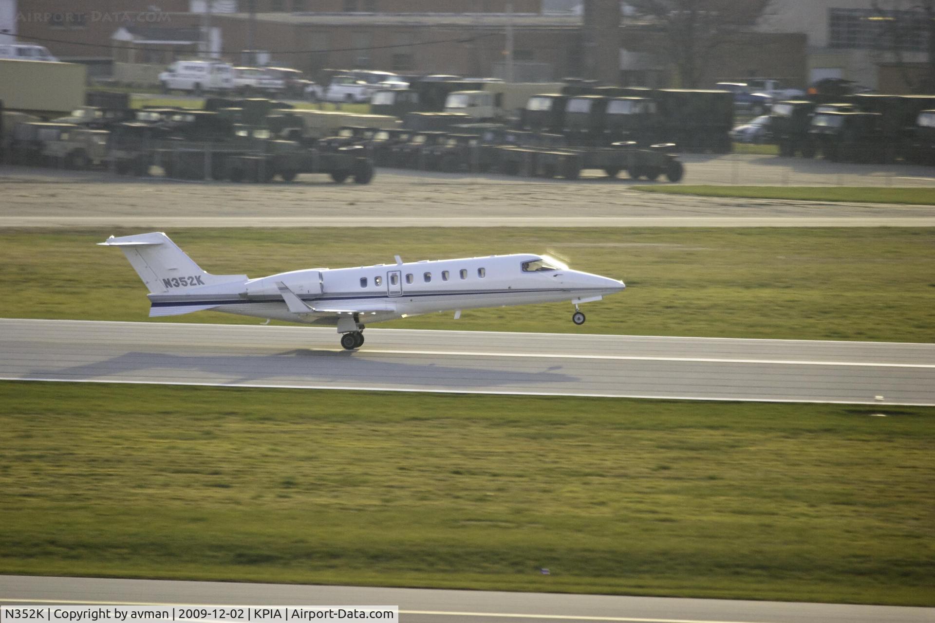 N352K, Learjet Inc 45 C/N 215, N352K departs Peoria Illinois