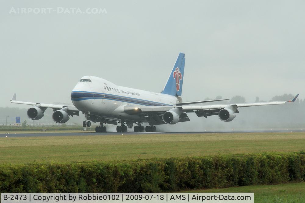 B-2473, 2002 Boeing 747-41BF/SCD C/N 32803, rainy day at AMS
