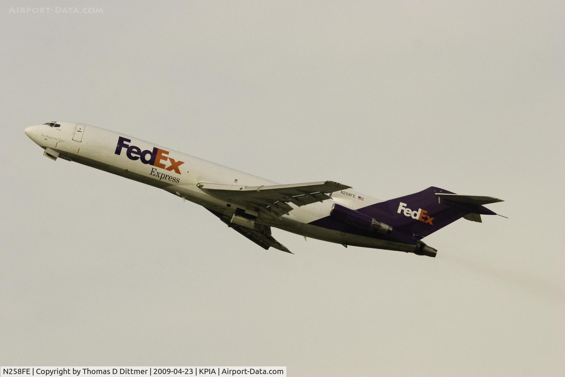N258FE, 1975 Boeing 727-233F C/N 20940, Federal Express (N258FE) climbs off Peoria Illinois